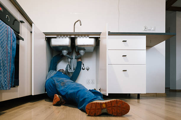 Professional Emergency Plumber technician working in Monroe, IA
